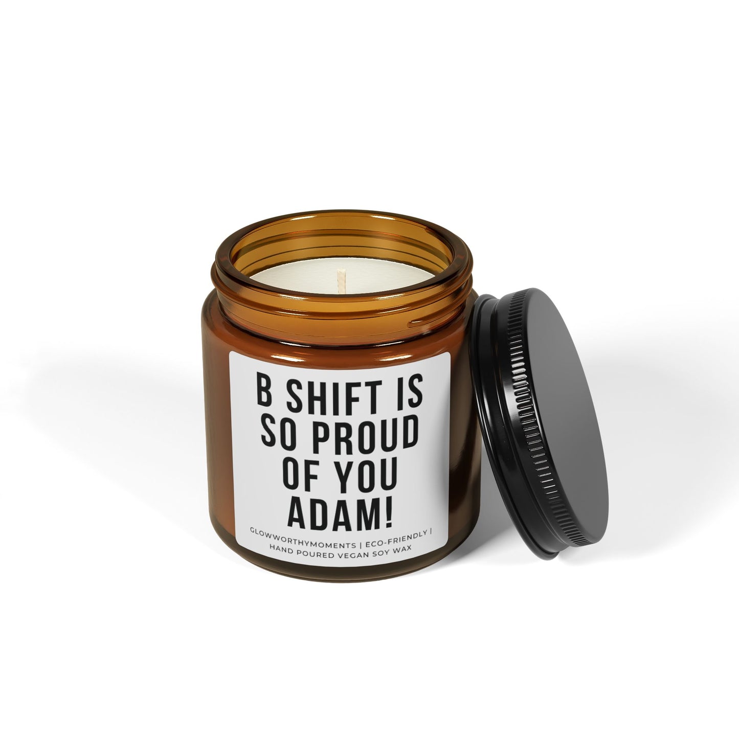 Candle in an amber jar with a personalized label on a white background