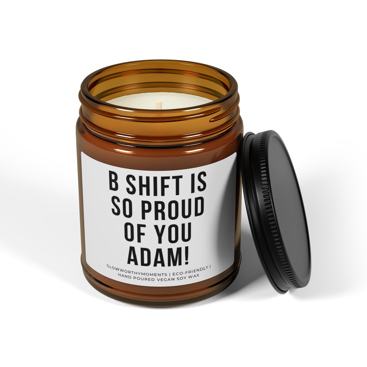 Candle in an amber jar with a label on a white background