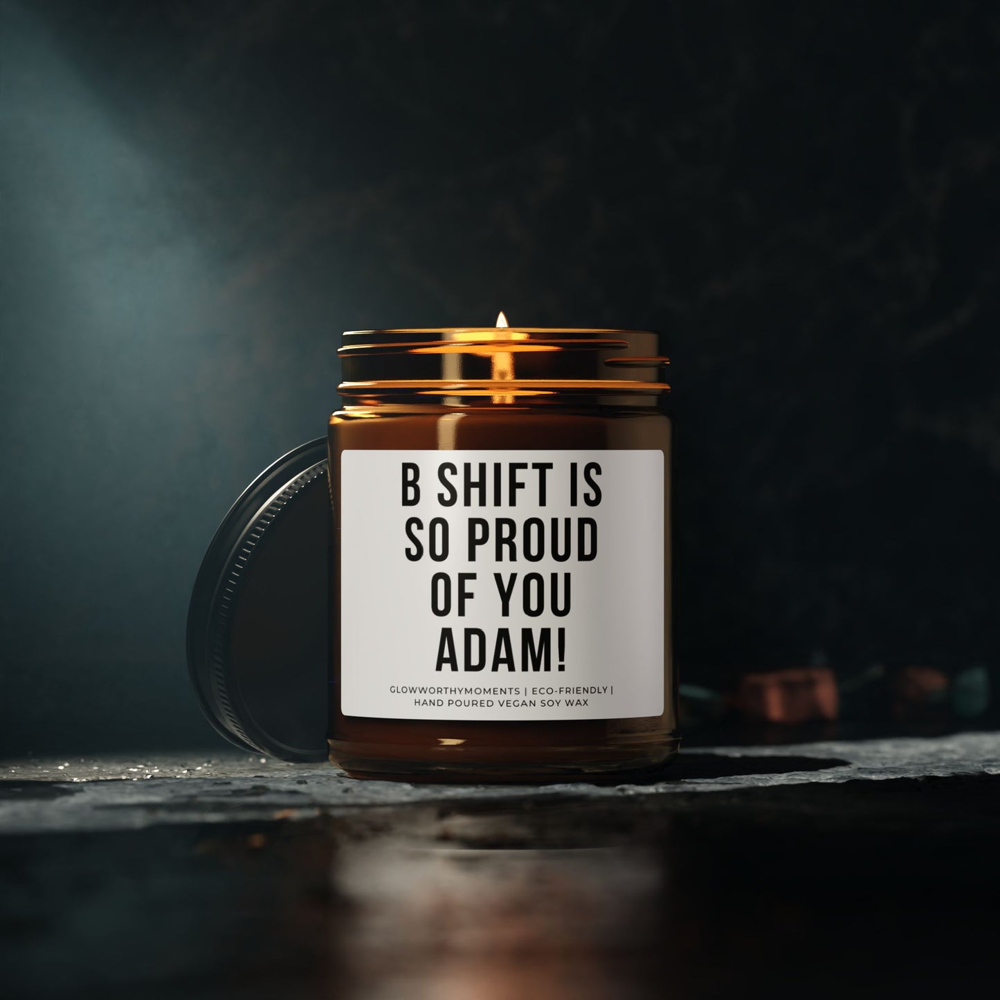 Candle in a jar with a personalized message on a dark background