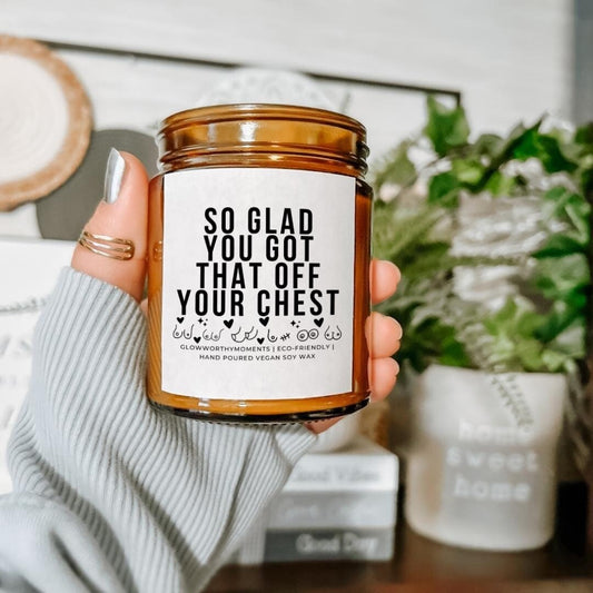 Woman smiling while receiving mastectomy candle as thoughtful breast cancer survivor gift