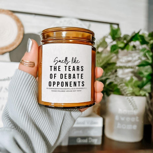 High school debate coach laughing with sarcastic champion candle