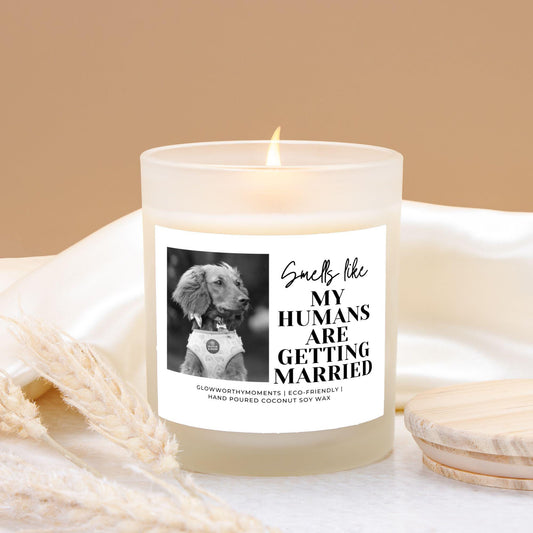Happy couple holding custom pet wedding candle with their dog after engagement