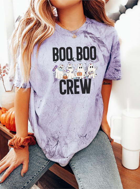 Person wearing a purple tie-dye t-shirt with 'BOO BOO CREW' text and ghost graphics.