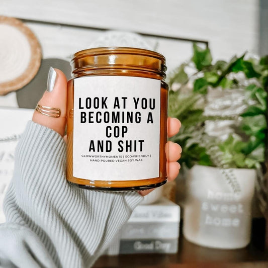 New officer receiving candle at academy graduation