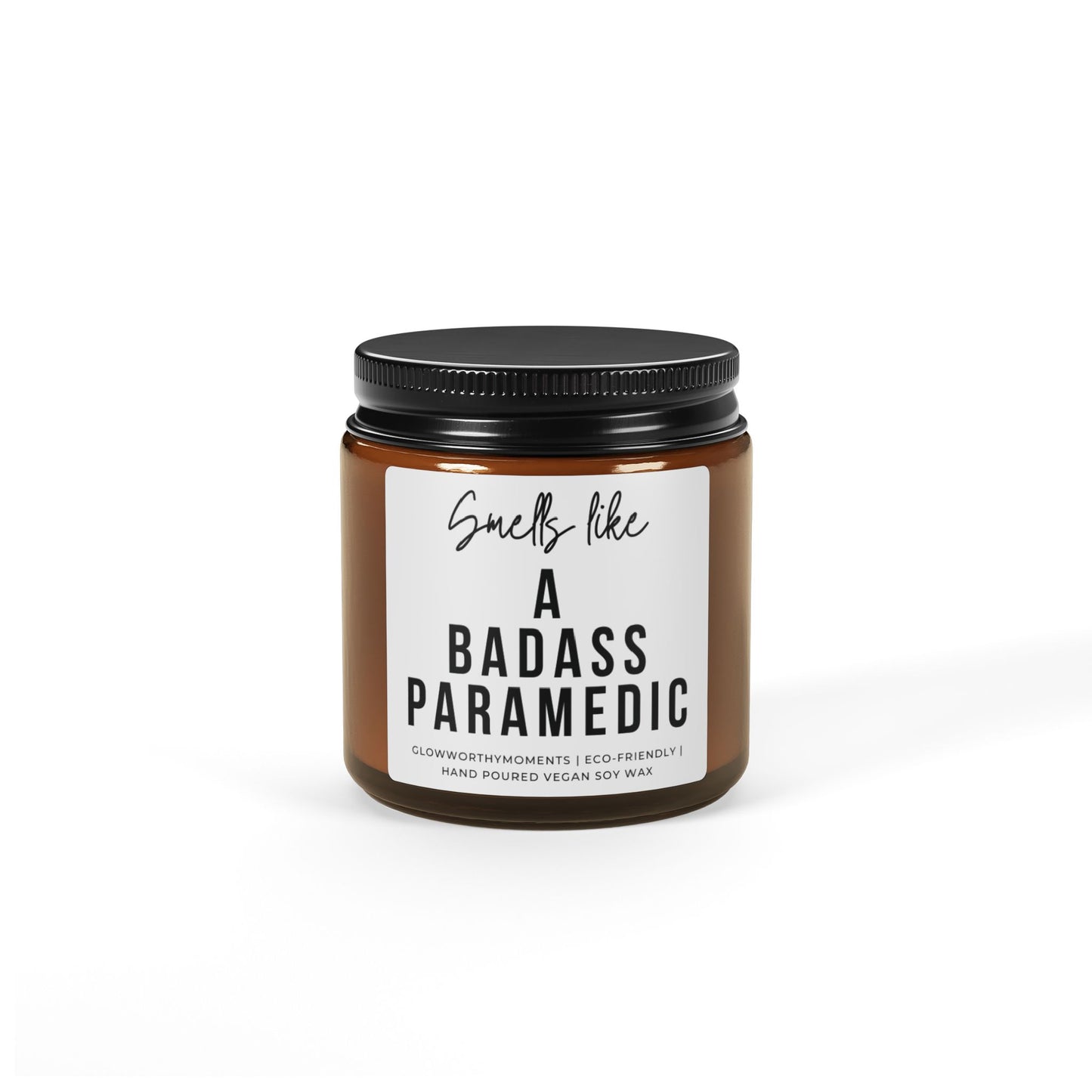 Candle jar with a label saying 'Smells like a badass paramedic' on a white background