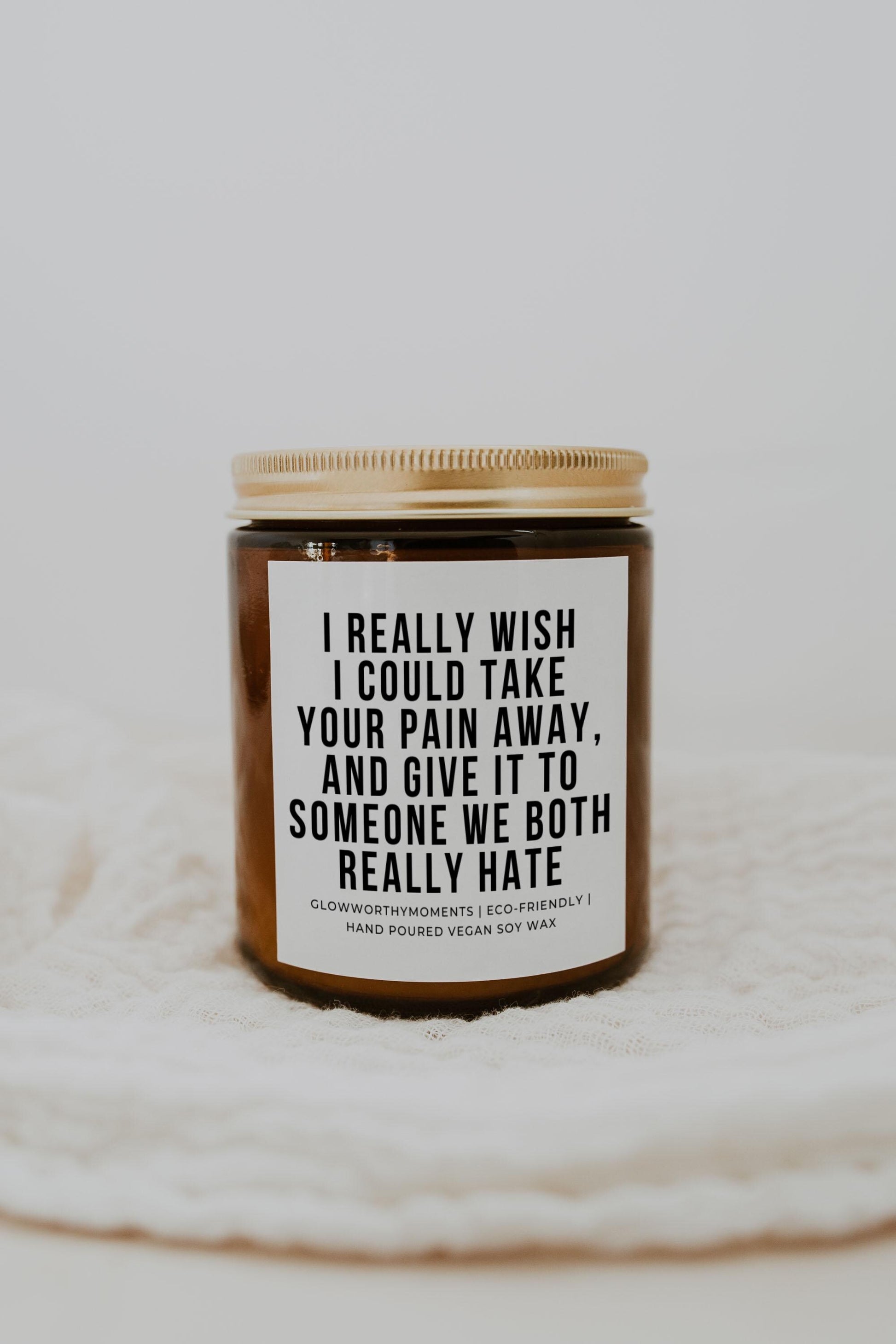 Dark humor gift set with candle, wine, and 'Burn Their Photos' matches