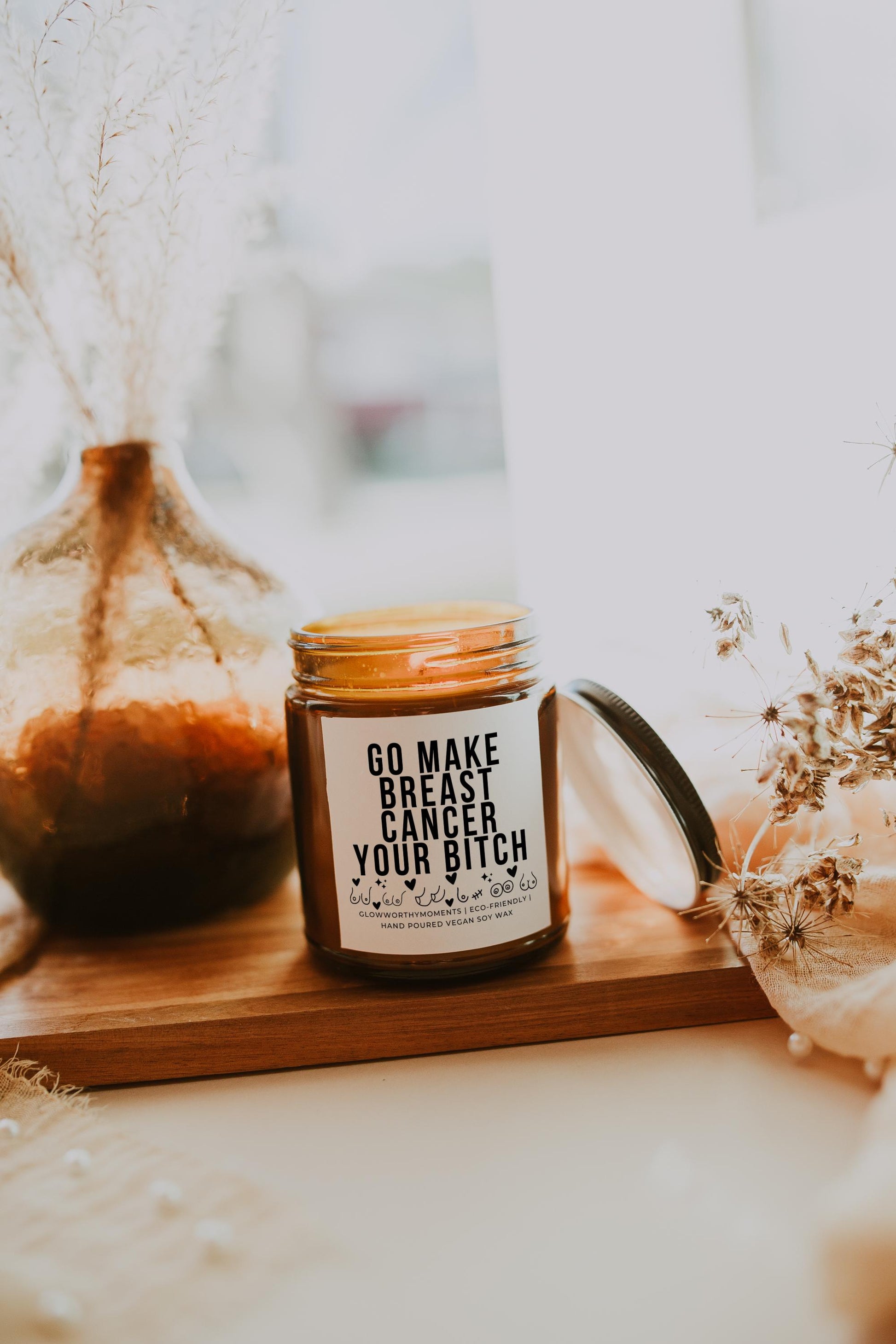 Bold mastectomy candle burning - symbolic survivor gift