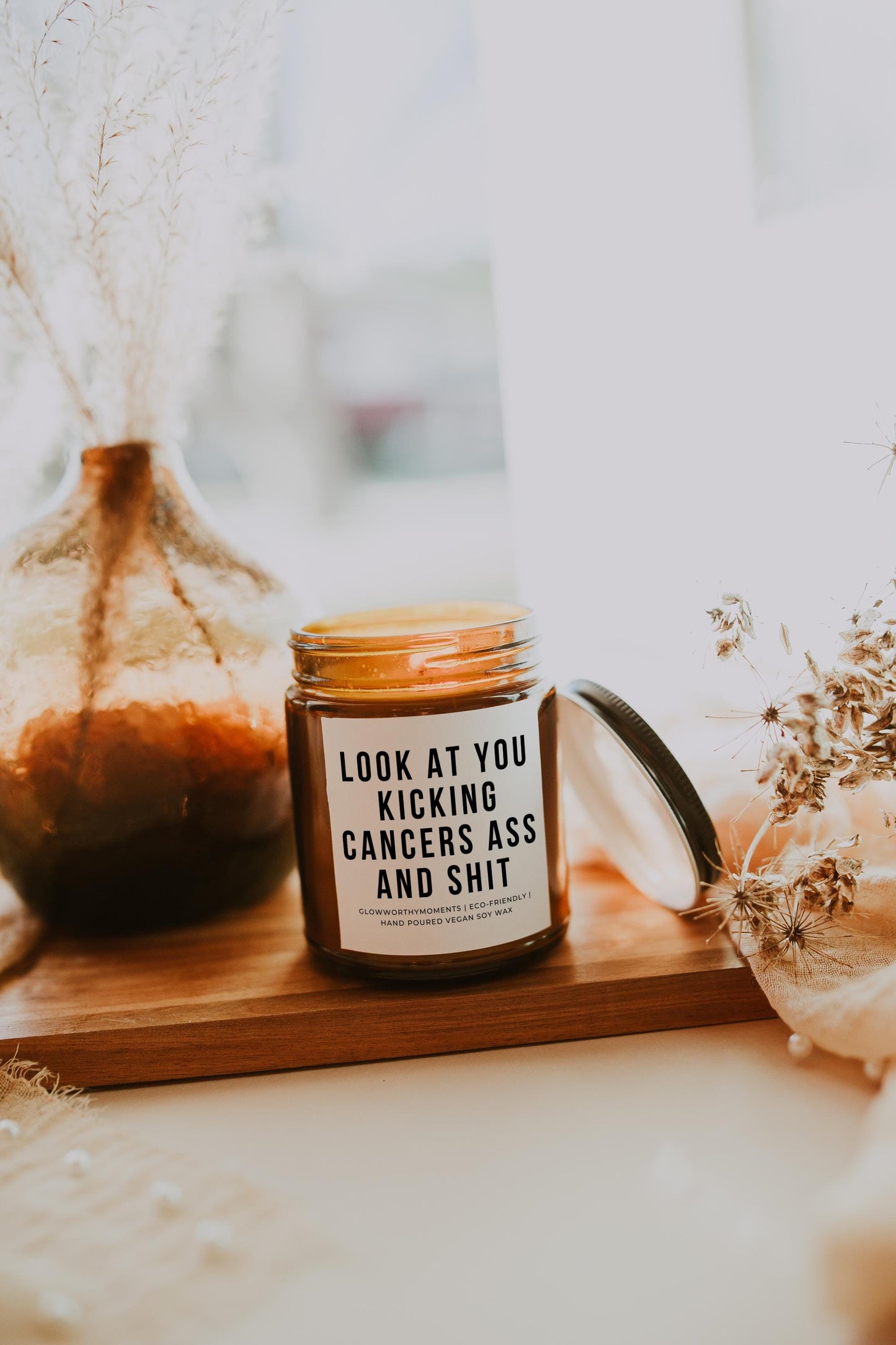 Edgy survivor gift with candle and 'F*ck Cancer' phrase