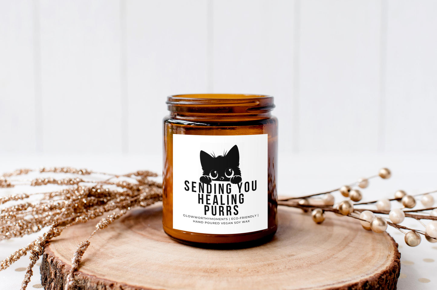 glass cat candle glowing softly