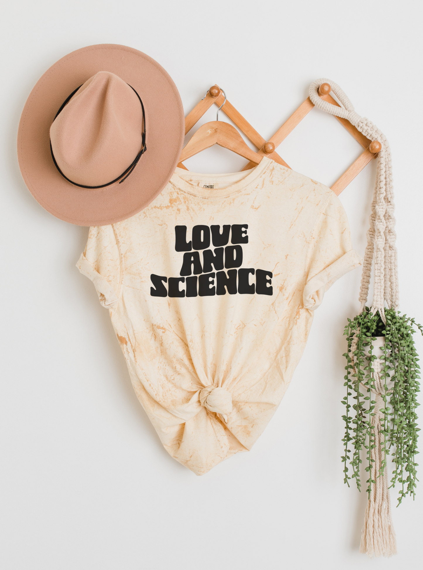 revealing pregnancy with 'Love & Science' shirt outfit idea