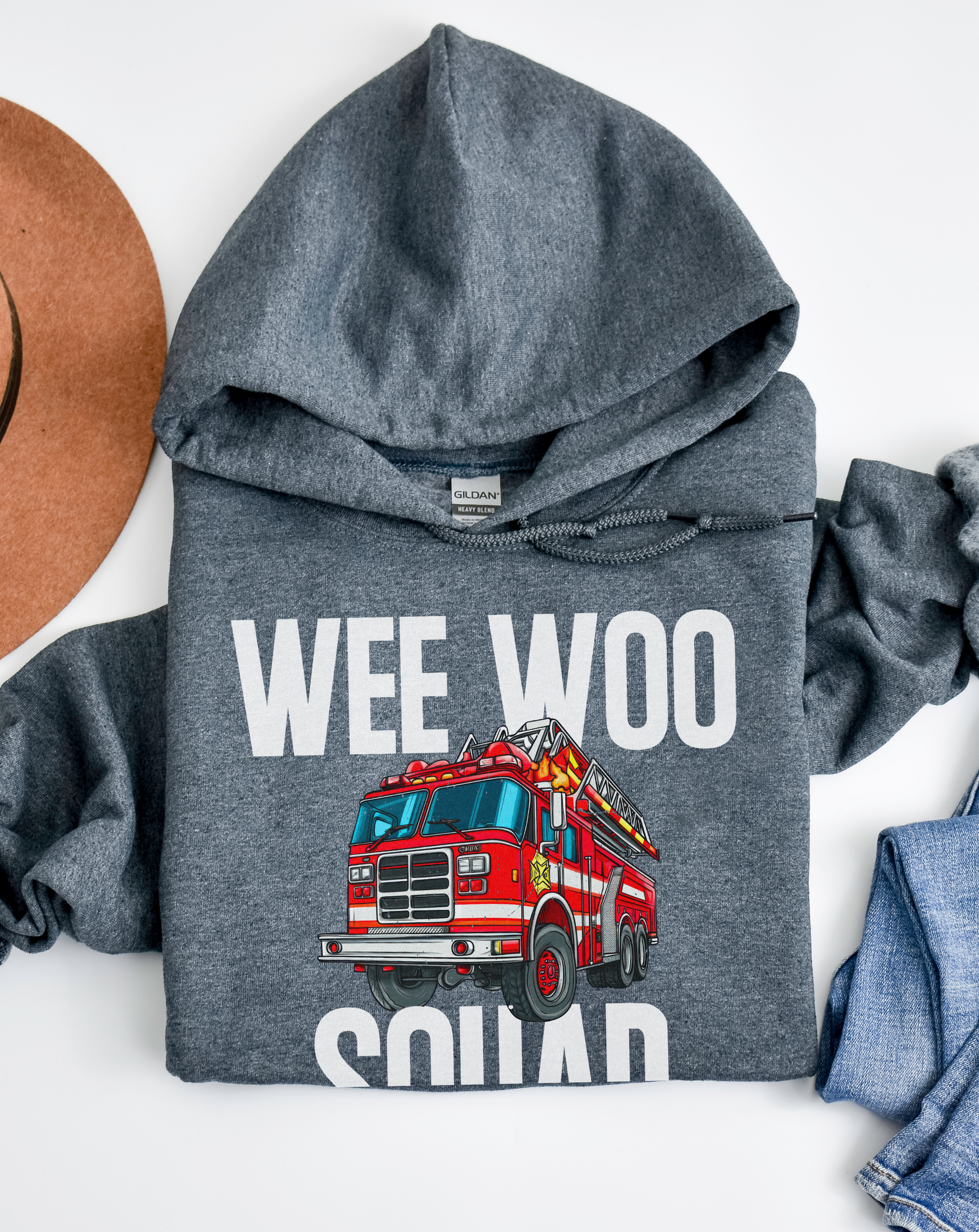 Gray hoodie with a red fire truck graphic and 'Wee Woo Squad' text on a white background